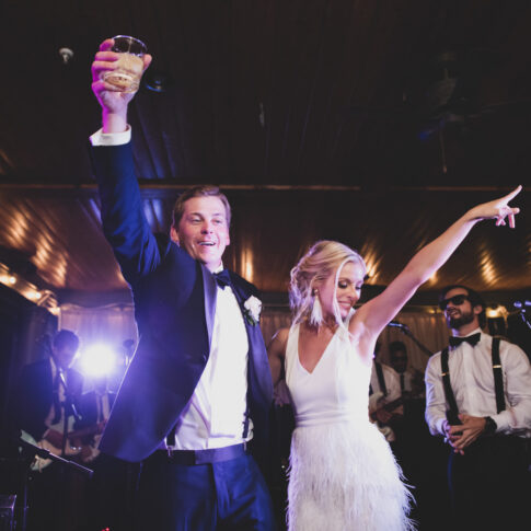 Man and wife celebrate with a dance at their wedding reception.