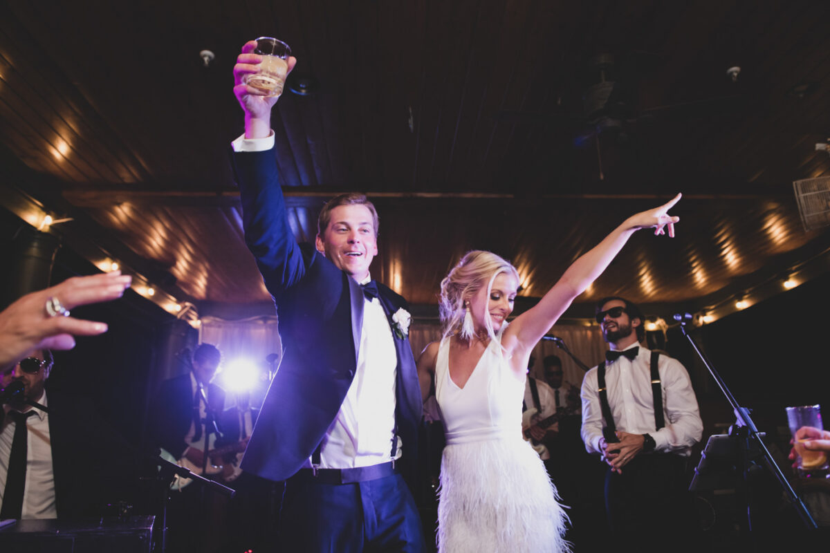 Man and wife celebrate with a dance at their wedding reception.