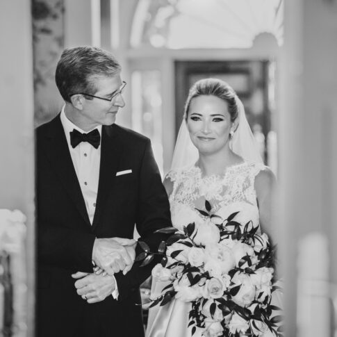 Father of the bride walks his daughter down the isle.