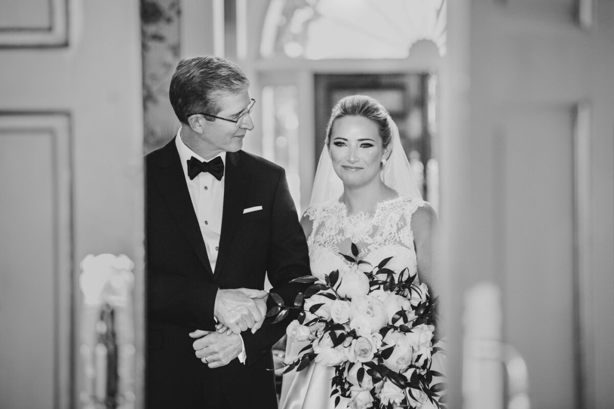 Father of the bride walks his daughter down the isle.