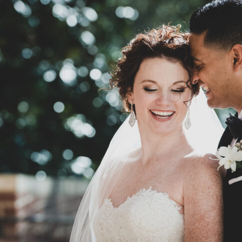 Photographed from Daniel Chapel at Furman University in Greenville, SC, the joyous newlyweds share an intimate moment of laughter.