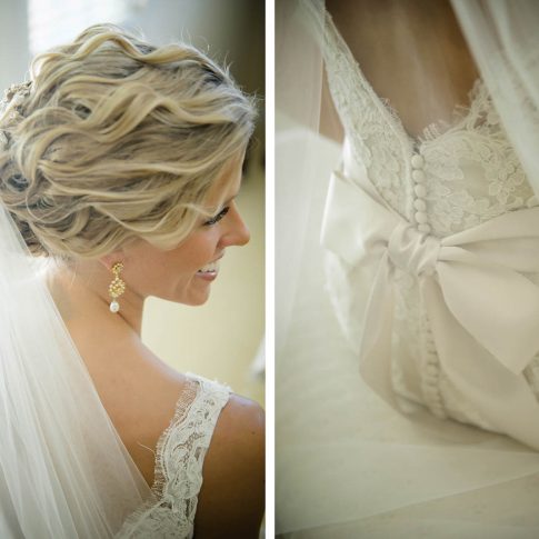 Gorgeous details are captured of the brides gold and pearl teardrop earrings which beautifully compliment her curled undo and tulle veil as well as the pristine satin bow that helps to secure the back of her white lace gown.