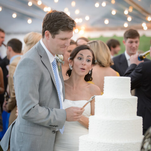 Groom licks cake knife