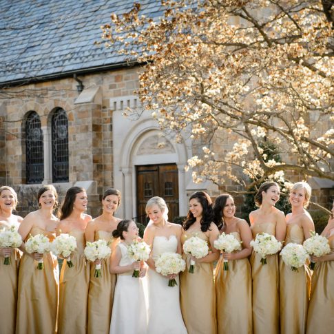 The bridesmaids and flower girl share a moment of laughter with the bride as they stand outside of Spartanburg Presbyterian Church where the ceremony will be located.