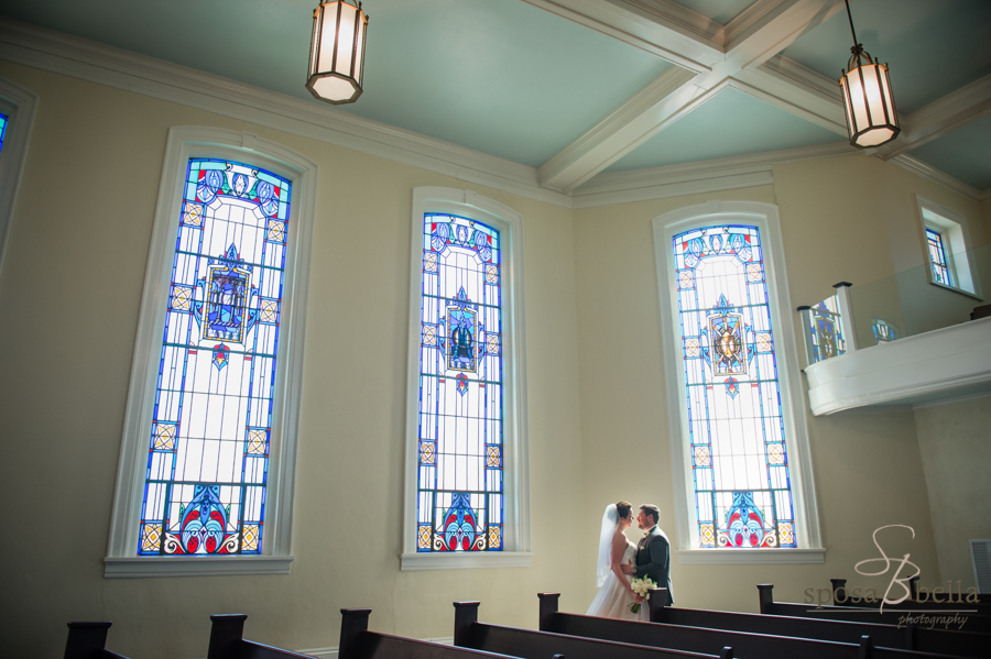 Beautiful stained glass from the Trinity Church of Greenville, and the newlyweds bathed in sunlight!