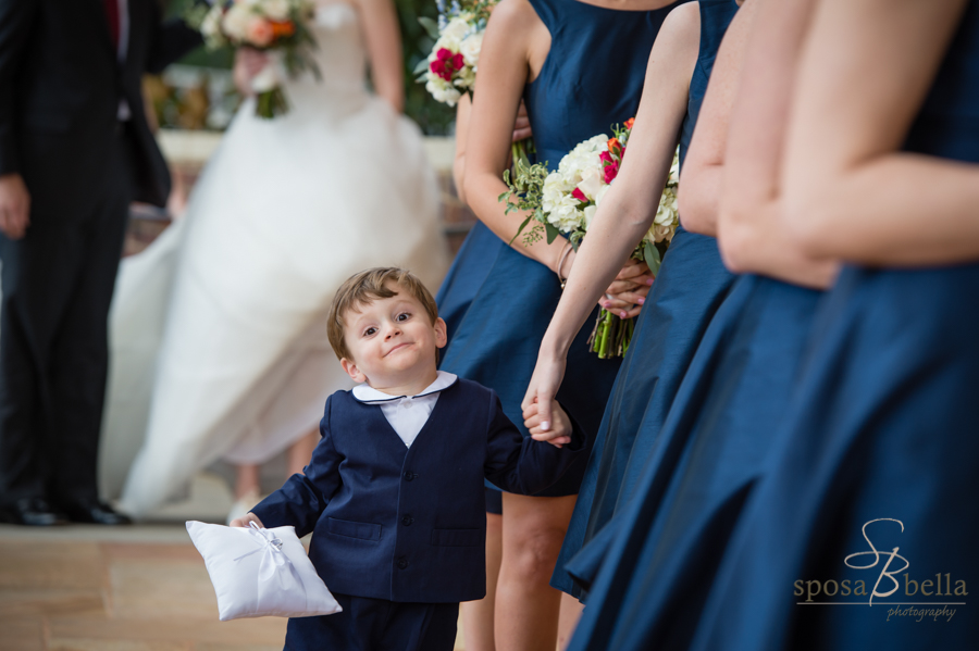 Adorable ring bearer lines up to enter the wedding ceremony at the Daniel Chapel at Furman University.