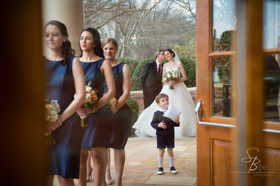 Photographed through the Furman wedding chapel doors, a father of the bride gives his daughter a kiss on the cheek before they walk down the isle!