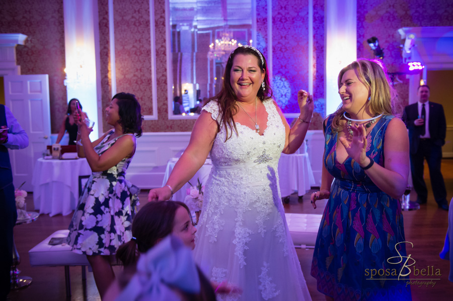 A bride dancing at her wedding reception.