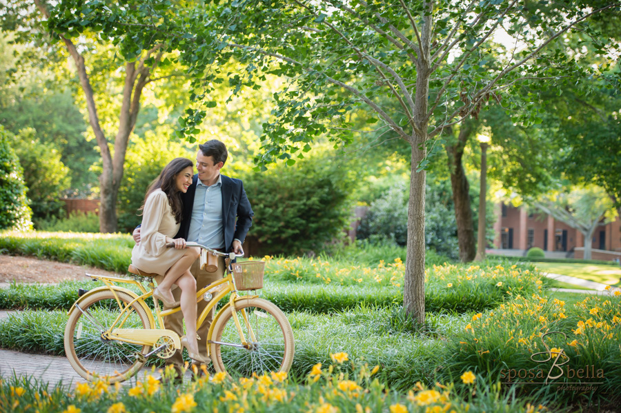 Soon-to-be husband guides his fiance on a bike ride through Furman University. 