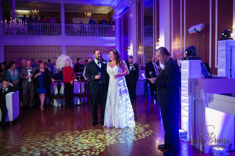 The father of the groom giving a toast at a wedding reception.