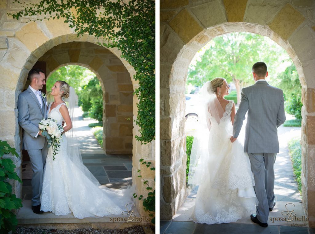 Newlyweds posed under a stone arch at a wedding chapel.