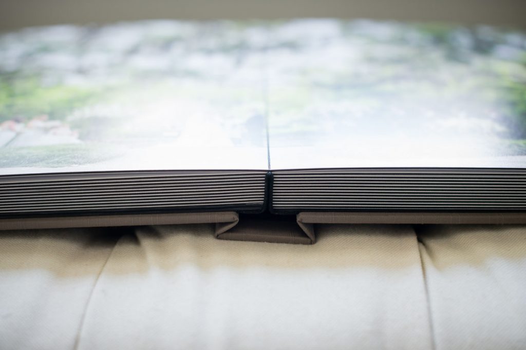 Lay flat binding of wedding album.