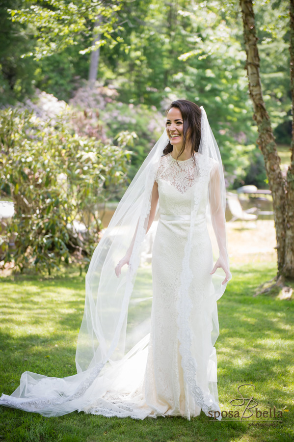 Bride laughs shortly before her wedding. 