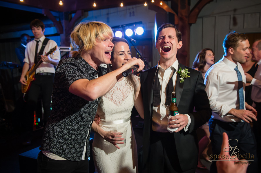 Bride and groom join the band in singing during their reception at the High Hampton Inn.