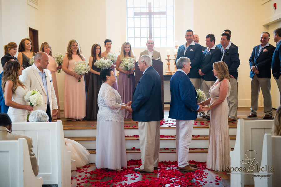 The groom and bride's parents renew their vows. 