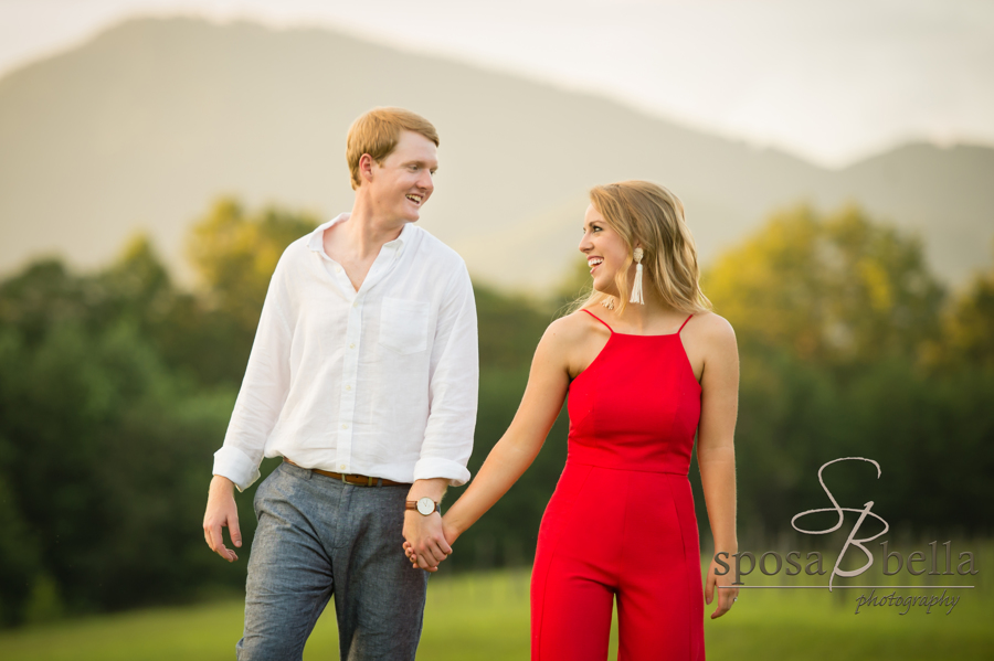 The adorable couple smiles at one another after becoming engaged. 