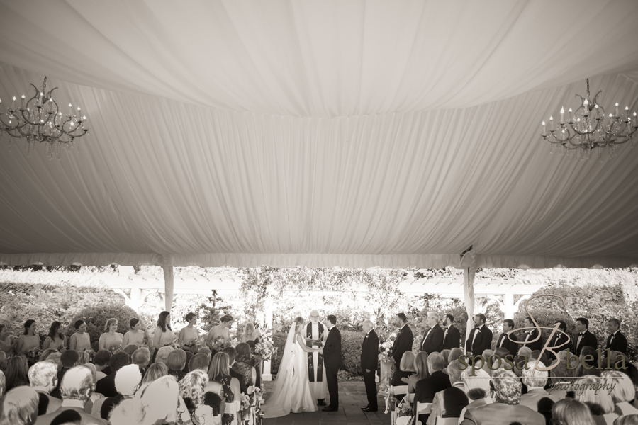 The couple's ceremony felt intimate yet open in an outdoor structure complete with chandeliers.