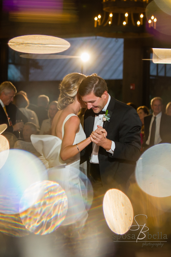 Charlie smiles widely as he shares a first dance with his new bride. 