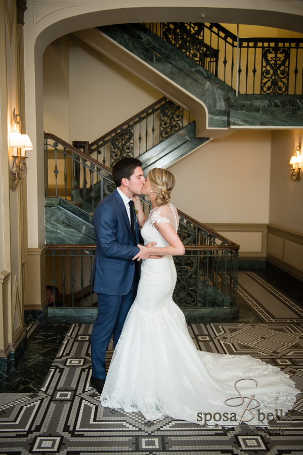 Husband and wife kiss on their wedding day.