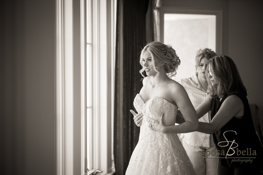 Bride getting dressed.